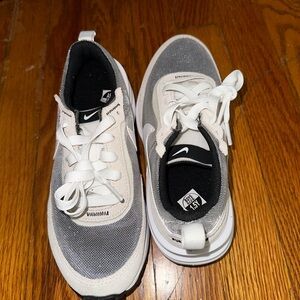 Gray and white Nikes size one and a half